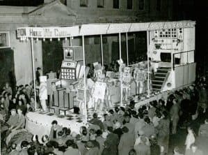 An early Bridgwater Guy Fawkes Carnival cart surrounded by spectators